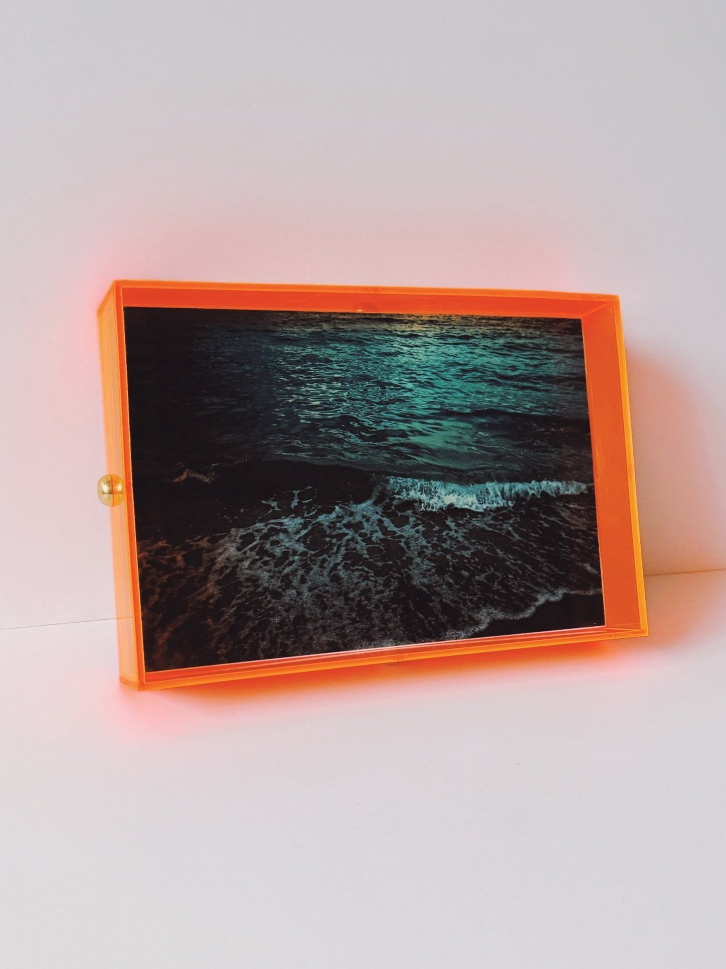 Teal Wave In Neon Orange Plexi Public Relations Media Kit Press Hook