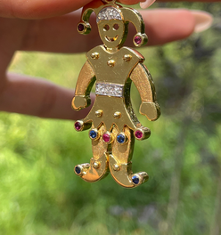 Vintage yellow 18K articulated Jester pendant with rubies, sapphires and diamonds