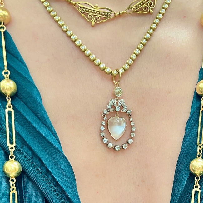 Incredible Antique 18K and 14K approx 1.22 ctw diamond and heart shaped moonstone bow pendant-gallery-54345820045627
