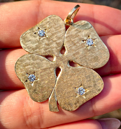 Vintage yellow 14K Cartier .25ctw star set diamond clover pendant