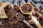 Coffee_in_a_cup_on_a_background_of_coffee_beans_by_Zadorozhnyi_Viktor_via_Shutterstock.jpg