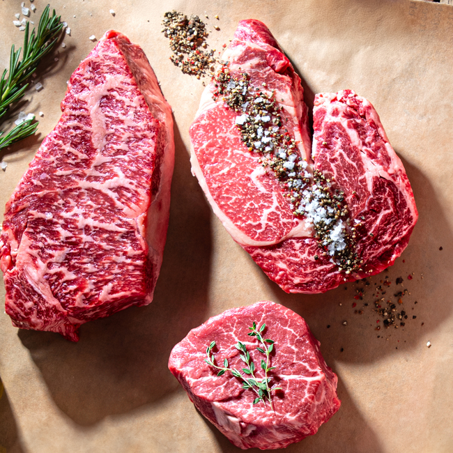 DLM Prime Steaks Photo of prime ribeye strip and filet mingon steaks.jpg