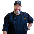 Johan wearing Summerset Grills chef jacket.png