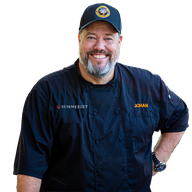 Johan wearing Summerset Grills chef jacket.png