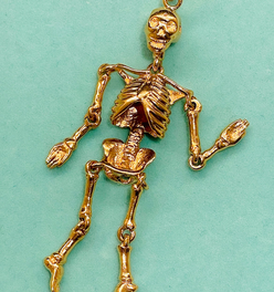 Vintage yellow 14K gold large articulated skeleton pendant