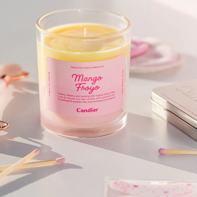 candier-mango-froyo-candle-on-book-stack.jpg