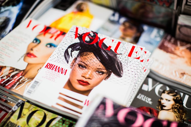 a stack of Vogue magazines