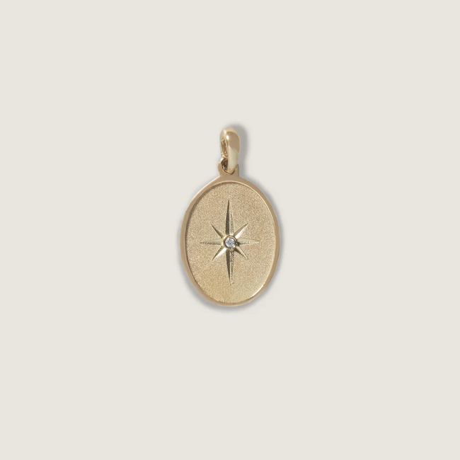 kinn_14k_gold_fine_jewelry_mother.ly_kinn_north_star_pendant_2_500524a1-b040-4b1c-ae34-071cea623fa8.webp