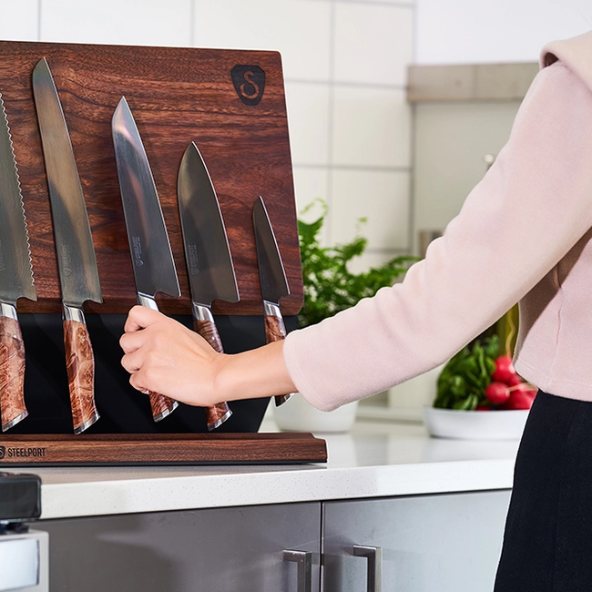 knife block with hands in kitchen.webp