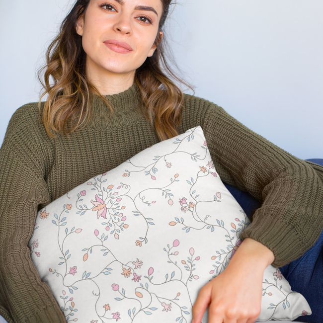 mockup-of-a-woman-holding-a-square-pillow-while-sitting-23577(1).jpg