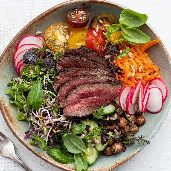 silver-fern-farms-venison-boneless-short-loin-cooked-dish-with-salad.webp